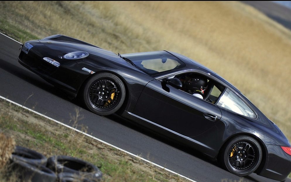 Brendan O'Connor driving his black Porsche 911 at Oregon Raceway Park